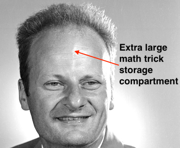 Black and white photo of Hans Bethe’s face, with an arrow pointing at his forehead labeled “Extra large math trick storage compartment”