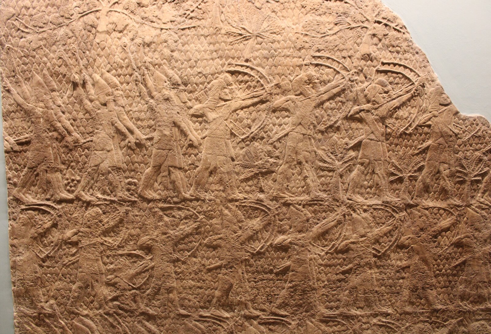 Assyrian archers and slingers assault the walls of Lachish, 701 BCE – the same campaign the Sennacherib Prism boasts about. Palace relief from Nineveh; photo by Zunkir, CC BY-SA 4.0, via Wikimedia Commons.